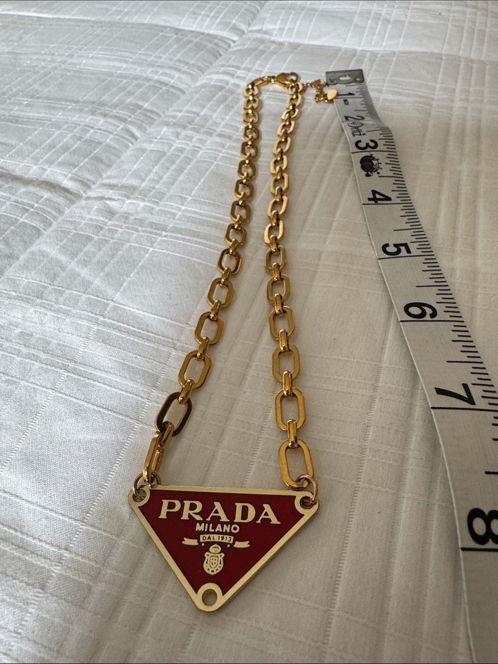 Prada Gold-Tone Chain Necklace with Red Triangle Pendant
